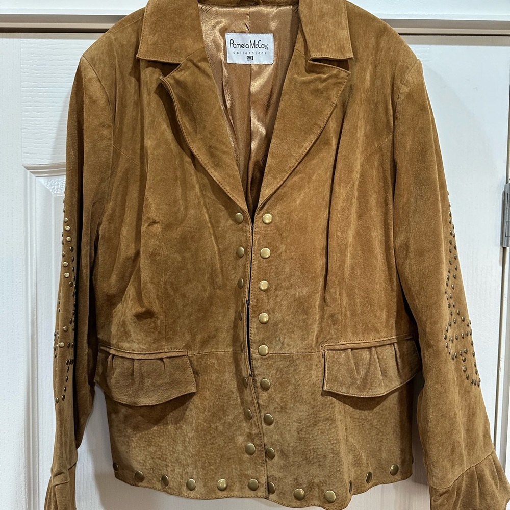 Leather jacket with brass rivet button detail